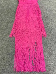 Detailed macro shot showcasing the dense fuchsia fringe texture on this evening bandage dress