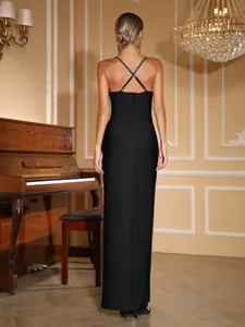Back view of an elegant black bandage evening gown featuring rhinestone cross-back straps