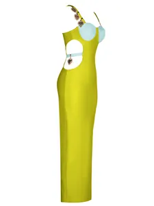 Close-up side view of a yellow bandage maxi dress featuring heart charms and hollow out back