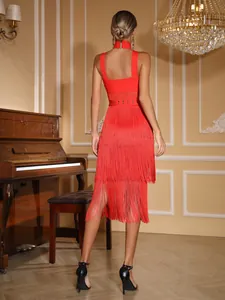 Stunning back detail of a red bandage dress with long fringe tassels and a high neck