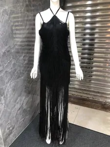 Elegant black halter neck evening dress featuring floor-length fringe tassels on a mannequin
