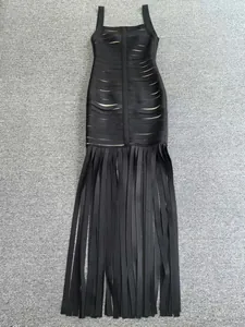 Full view detail of a black bandage dress with long fringe tassels and bodycon silhouette.