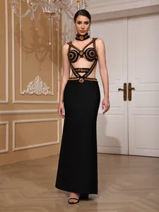 Elegant black bandage evening gown with intricate gold beadwork and matching choker.