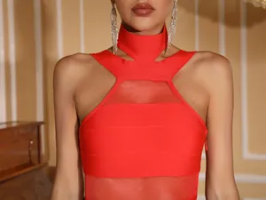 Detail of a red high-neck halter bandage dress with mesh paneling and knit texture