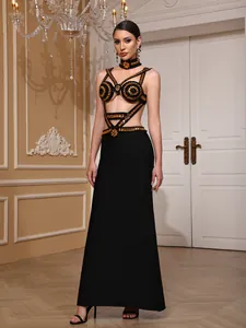 Detail view of a black evening gown with ornate gold beadwork and matching beaded choker.