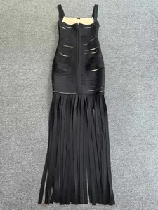 Detailed view of black bandage evening dress with unique fringe skirt and slim fit design