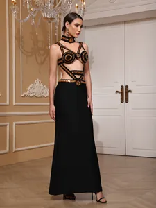Detailed view of sexy beaded black and gold bandage evening gown with cutout design