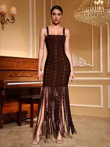 Detail view of dark brown bandage dress featuring sparkling rhinestones and tassels