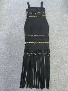Elegant black bandage bodycon evening dress with gold bead accents and long fringe tassels