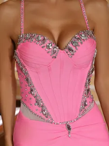 Detail shot of a pink bandage dress bodice with luxury rhinestone heart-shaped neckline