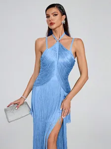 Detailed look of blue fringe halter maxi dress with shimmering silver evening clutch.