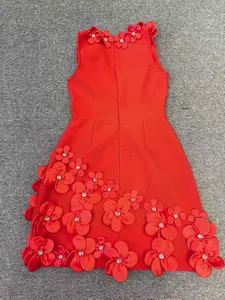 Back view of red sleeveless bandage dress featuring heavy 3D floral appliqués with crystals.