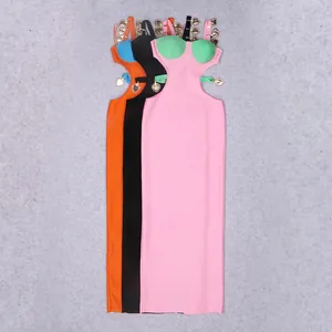Detail of hollow-out bandage dresses featuring heavy-duty gold alloy heart charms