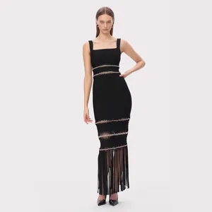 Elegant black bandage evening dress with beaded cut-outs and long fringe hem.