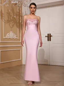 Detailed view of pink strapless bandage dress with sparkling crystal beadwork.