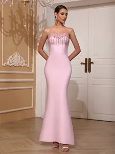 Elegant pink strapless bandage mermaid dress with crystal embellishments for evening