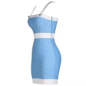 Side view detail of elegant light blue and white bandage dress with crystal studs