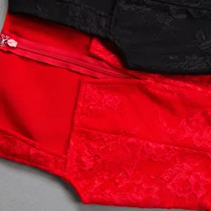 Detail view of red floral lace fabric and invisible zipper on a bandage dress