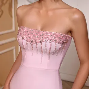 Elegant pink strapless bandage mermaid dress with intricate pearl and rhinestone beadwork
