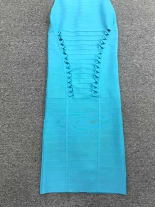 Close-up view of a bright blue bandage dress featuring intricate side-lacing detail