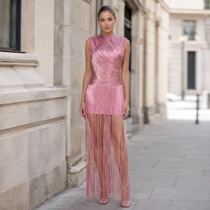 Detailed view of a pink sleeveless evening gown with silver thread and fringe.