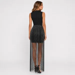 Elegant rear view of a black sleeveless bandage dress with long silver fringe detail.