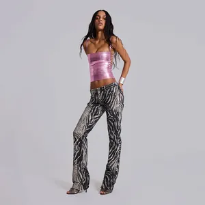 Full view of slim fit pink metallic square neck bandage camisole on fashion model
