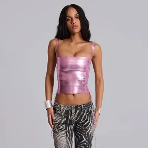 Close-up of metallic pink bandage crop top with side lace-up details and square neck.