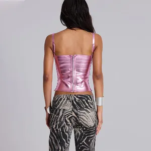 Back view of metallic pink slim-fit corset top with zipper closure and zebra pants