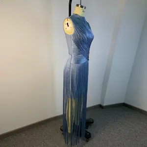Side view of a blue sleeveless tassel bandage dress with shimmering silver threads