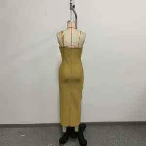 Back view detail of a high-elastic gold knit bandage dress displayed on a professional mannequin