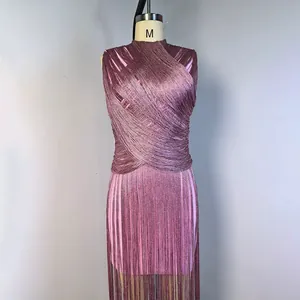Detailed view of mauve sleeveless fringe bandage dress with metallic shimmer on mannequin
