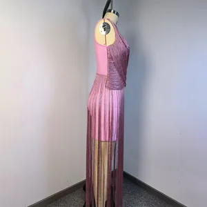 Side detail of a pink sleeveless bandage dress featuring long shimmering silver fringe.