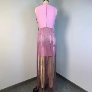 Close-up back view of a pink sleeveless bandage dress with shimmering silver fringe details
