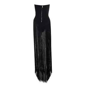 Back view detail of black strapless romper with long fringe tassels and back zipper.