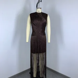 Close-up view of a sleeveless shimmering tassel bandage evening dress for festive parties.