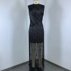 Detail view of a black silver thread sleeveless tassel bandage dress on a mannequin