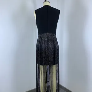 Back detail of elegant black sleeveless evening dress with shimmering silver tinsel fringe