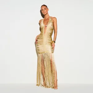 Elegant gold halter neck evening gown with deep V-neck and dramatic long fringe