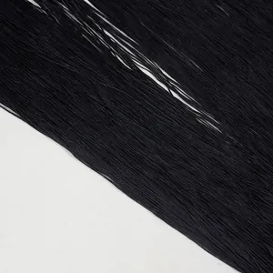 Detail shot of the black silky tassel fringe textures for a chic party jumpsuit