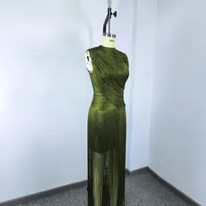 Detailed close-up view showing the texture of green fringe bandage dress on mannequin