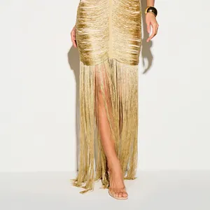 Close-up detail of high-shine golden fringe tassel evening gown for glamorous parties