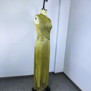 Side view of a gold metallic fringe sleeveless bandage evening gown on a mannequin