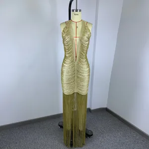 Detailed view of a gold metallic fringe halter dress with deep V-neck on a mannequin