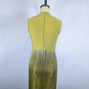 Back view of a sleeveless yellow bandage dress with silver metallic fringe detail
