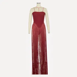 Detail view of a sparkly red tube top jumpsuit with long elegant floor-length fringe