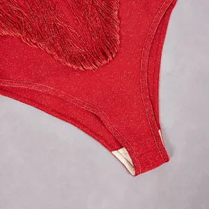 Close-up of red glitter bodysuit detailing shimmering fabric and elegant fringe trim