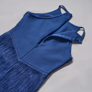 Detailed view of the invisible back zipper and blue fringe on a sleeveless bandage dress