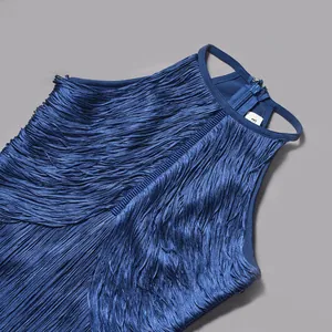 Close-up macro view of high-quality blue fringe detailing on a sleeveless party cocktail dress