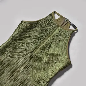 Close-up of olive green fringe sleeveless bandage dress with layered tassel detail